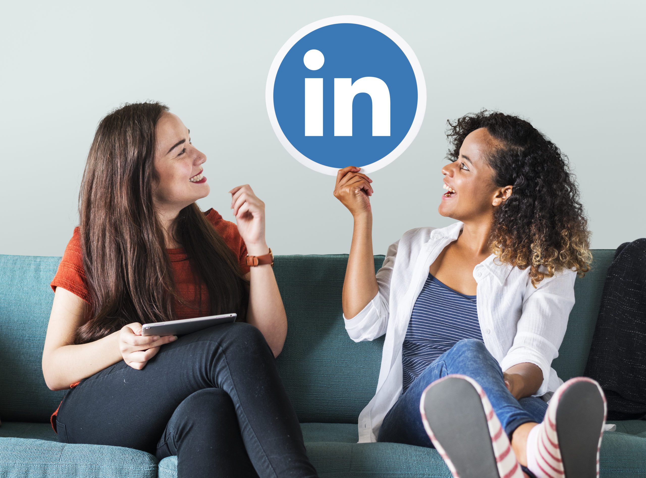 Apprentices holding emoticons on a couch LinkedIn Tips for Apprentices